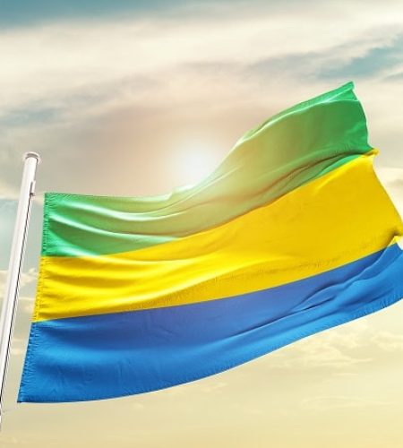 Gabon,National,Flag,Waving,In,Beautiful,Clouds.